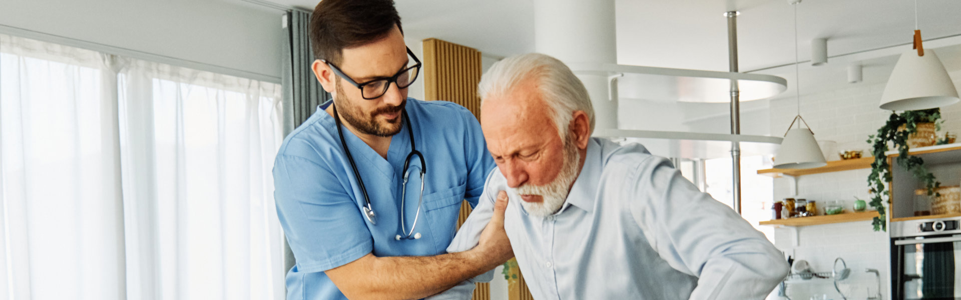 nurse guiding his patient in walking