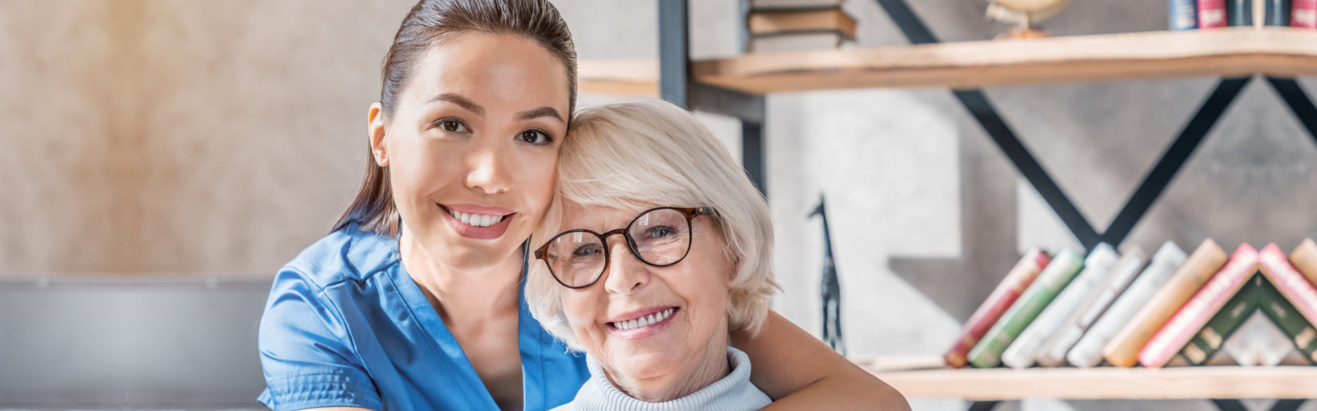 Nurse hugging elderly